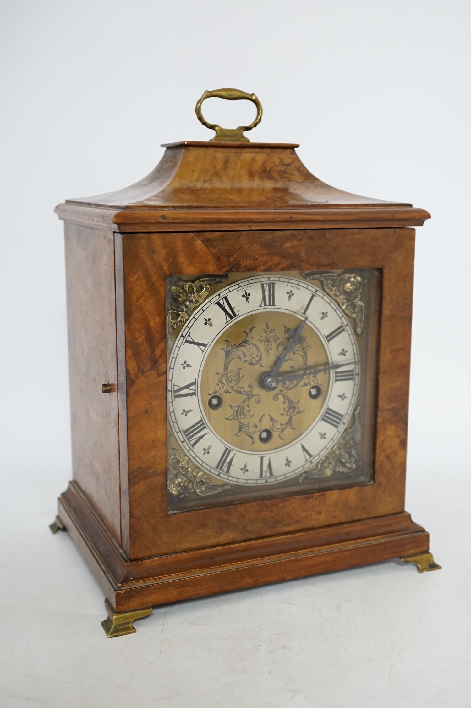 A Mappin & Webb walnut mantel clock, with key, 28.5cm high. Condition - case good, not tested